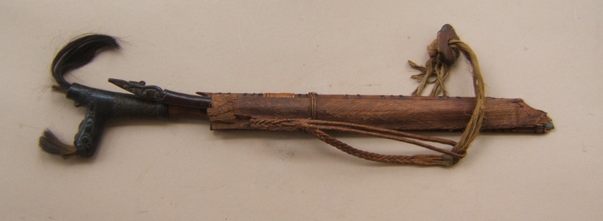 A FINE ORIGINAL 19TH/EARLY 20th CENTURY DYAK HEADHUNTER'S MANDAU & SCABBARD, ca. 1890 view1