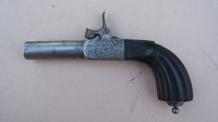 A VERY FINE CONTINENTAL EUROPEAN EBONY STOCK FRENCH MUFF PISTOL, ca. 1850 view 1